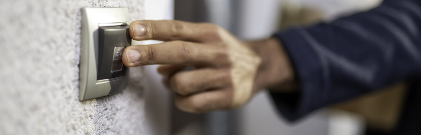 fingers on a doorbell