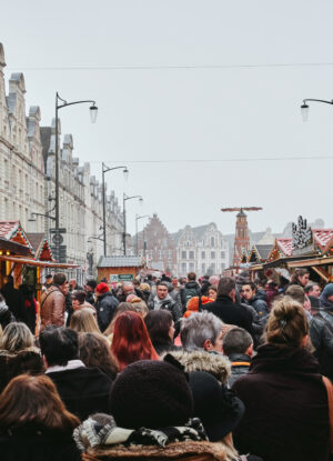 foggy day of december in arras, france. some people do some shopping.