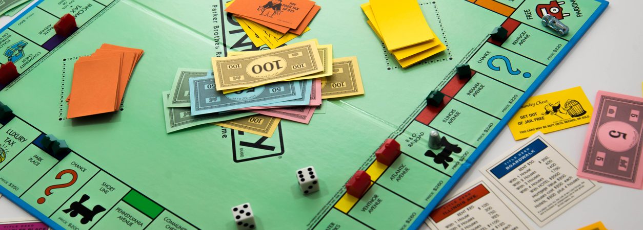 monopoly game in play money, dice, pieces and cards