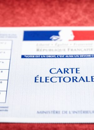 french electoral voter card official government allowing to vote paper close up on red cardboard file