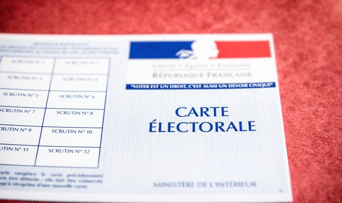 french electoral voter card official government allowing to vote paper close up on red cardboard file