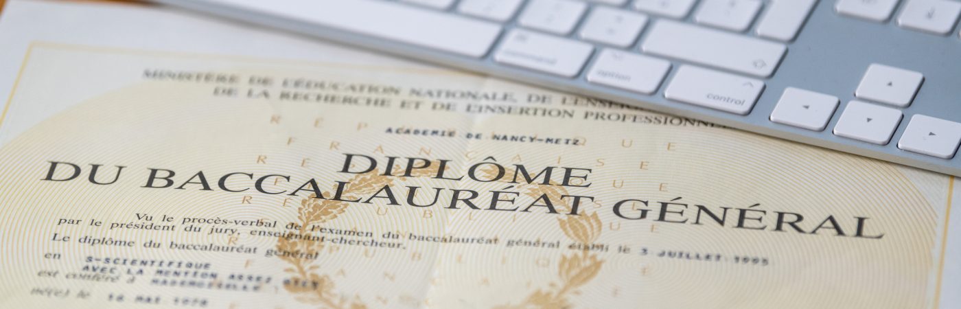 paris, france march, 26, 2020 baccalaureate certificate and keyboard in france