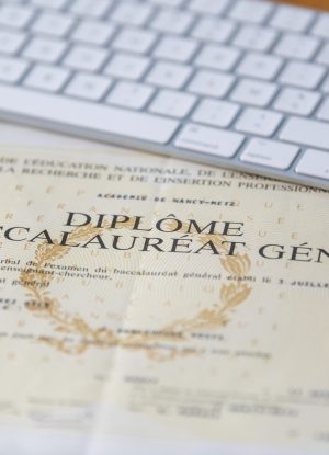 paris, france march, 26, 2020 baccalaureate certificate and keyboard in france