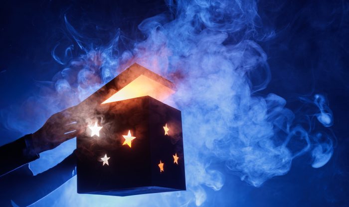 glowing magic mystery box opening with smoke and stars on blue background